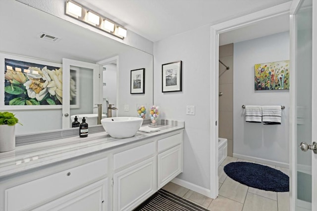 bathroom featuring vanity, tile patterned floors, and shower / bathtub combination