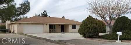 ranch-style house featuring a garage