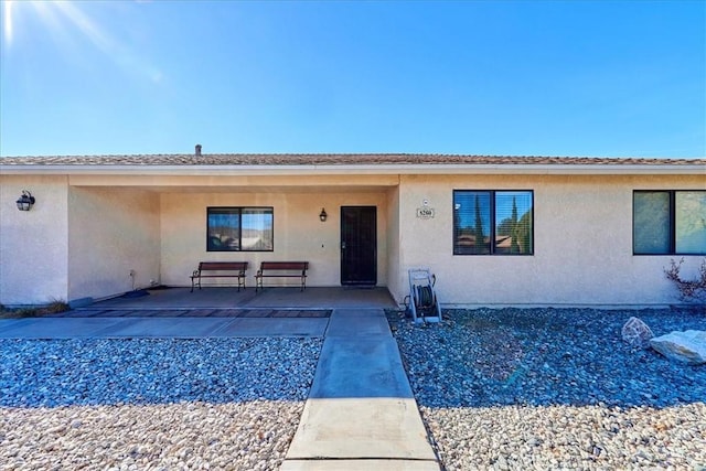 rear view of property featuring a patio