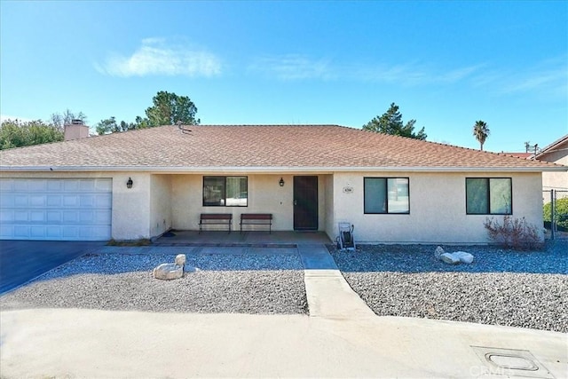 single story home with a garage