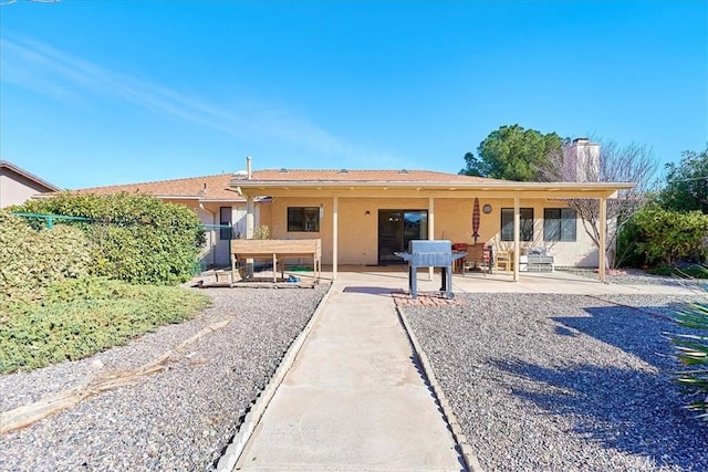 rear view of property with a patio area