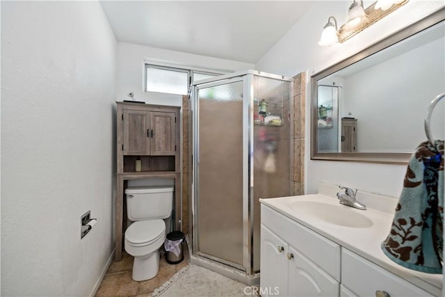 bathroom featuring vanity, a shower with shower door, tile patterned floors, and toilet