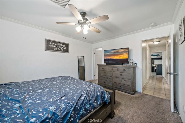 carpeted bedroom with ceiling fan and crown molding