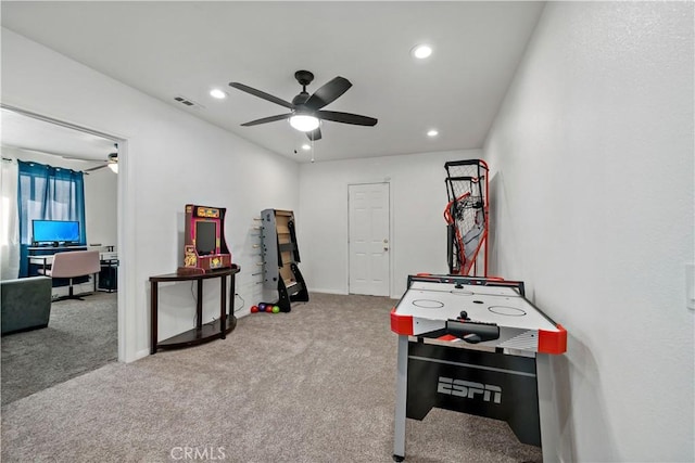 game room with ceiling fan and carpet