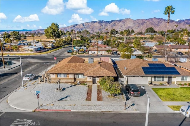 birds eye view of property with a mountain view