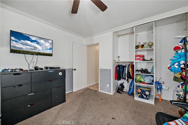 bedroom featuring ceiling fan, light carpet, a closet, and crown molding