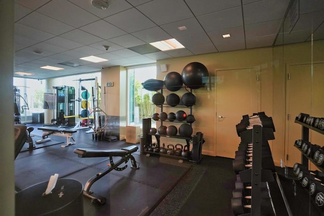 exercise room featuring a drop ceiling