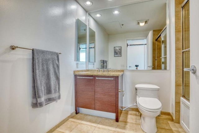 full bathroom featuring tile patterned floors, bath / shower combo with glass door, toilet, and vanity