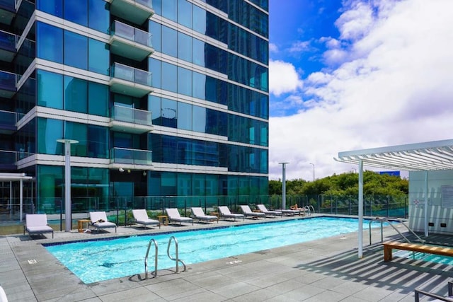 view of pool with a patio and a pergola