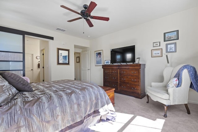 bedroom featuring ceiling fan and light colored carpet