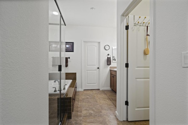 bathroom with independent shower and bath and vanity