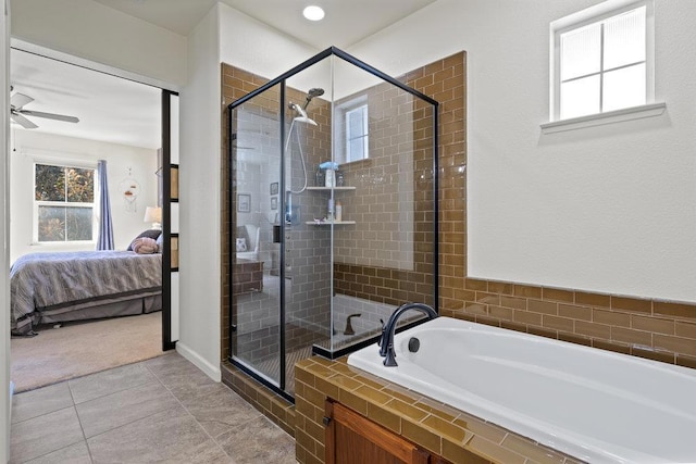 bathroom featuring ceiling fan, tile patterned flooring, and plus walk in shower