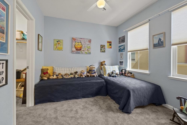 carpeted bedroom featuring ceiling fan