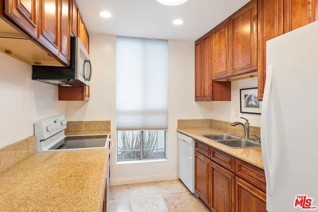 kitchen with sink and white appliances