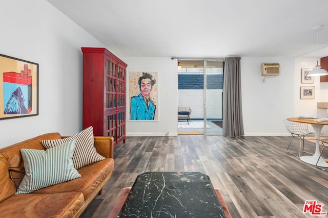 interior space with a wall mounted AC, a wall of windows, and dark hardwood / wood-style floors