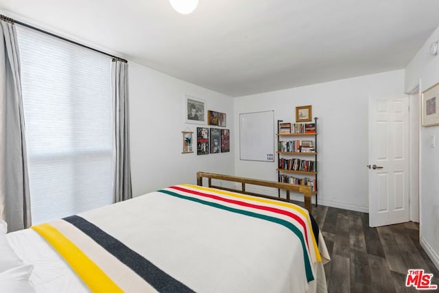 bedroom featuring dark hardwood / wood-style floors