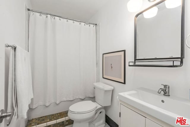 bathroom with toilet and vanity