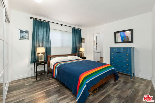 bedroom with ensuite bathroom and dark wood-type flooring