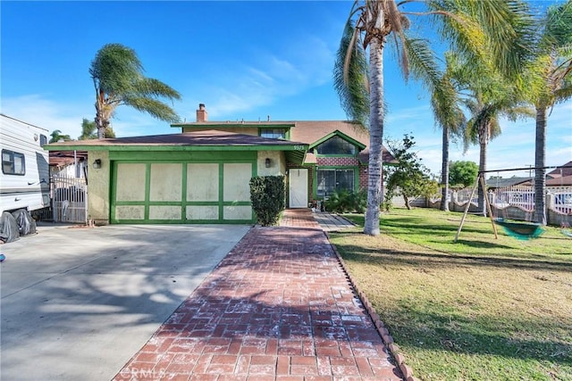 view of front facade featuring concrete driveway, a front yard, stucco siding, and a chimney