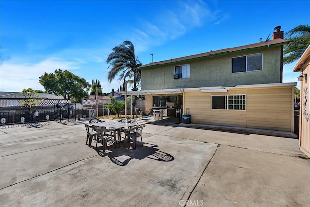 back of house with a patio area