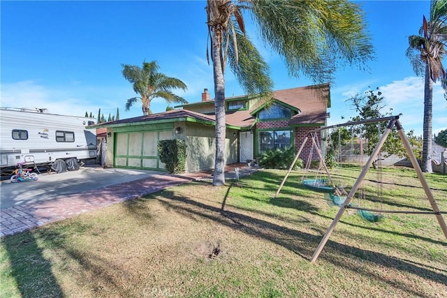 view of front of property with driveway and a front yard