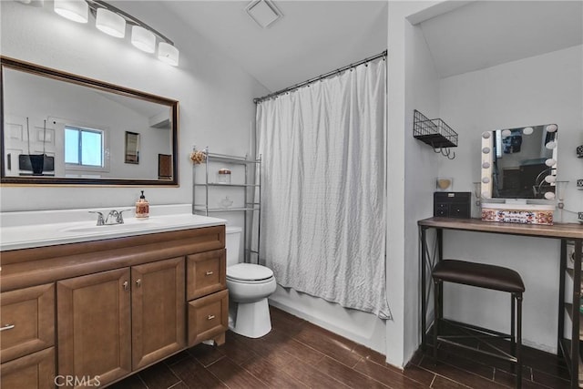 full bathroom featuring toilet, vanity, and shower / bath combo with shower curtain