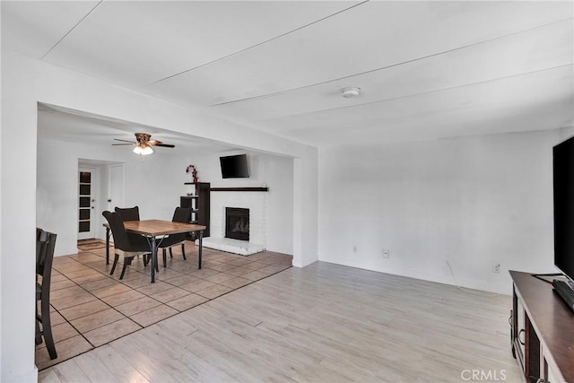 dining space featuring ceiling fan and light hardwood / wood-style floors