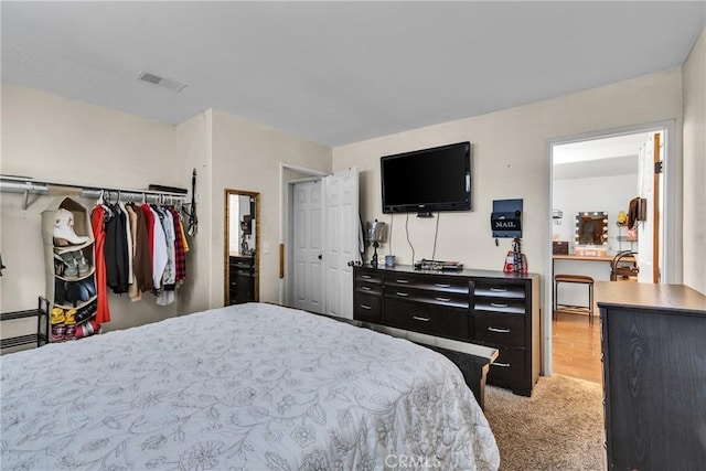 carpeted bedroom with a closet