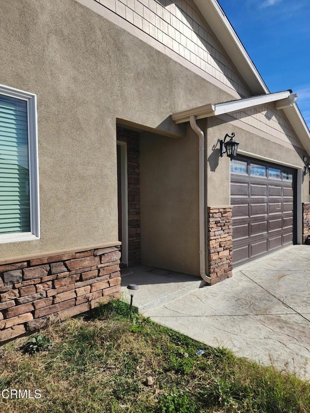 view of side of home featuring a garage