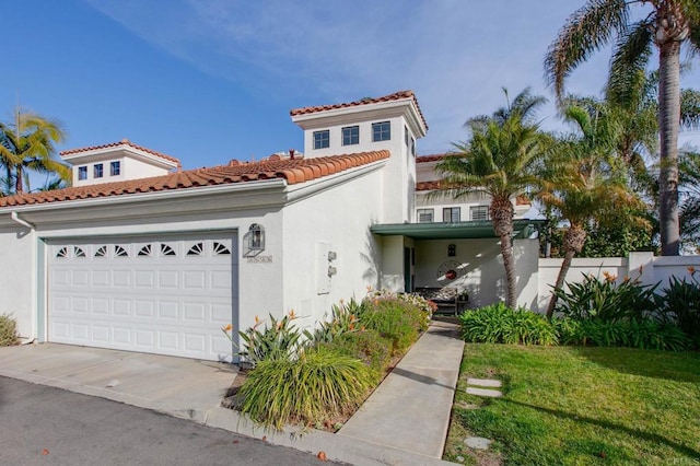 mediterranean / spanish-style house with a garage and a front lawn