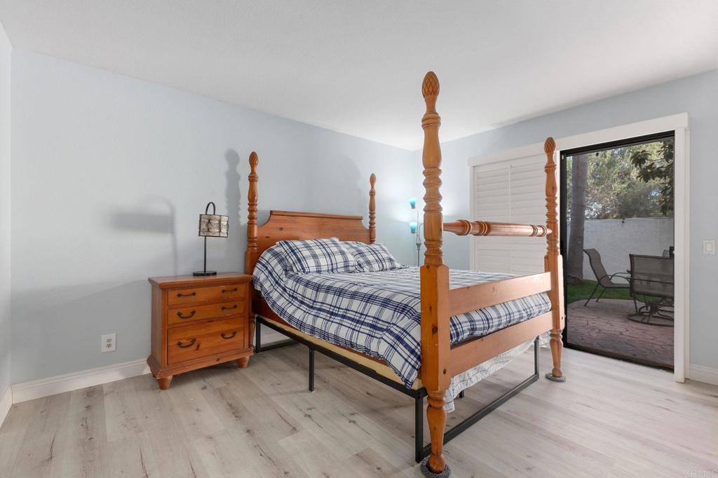 bedroom with light hardwood / wood-style flooring and access to outside