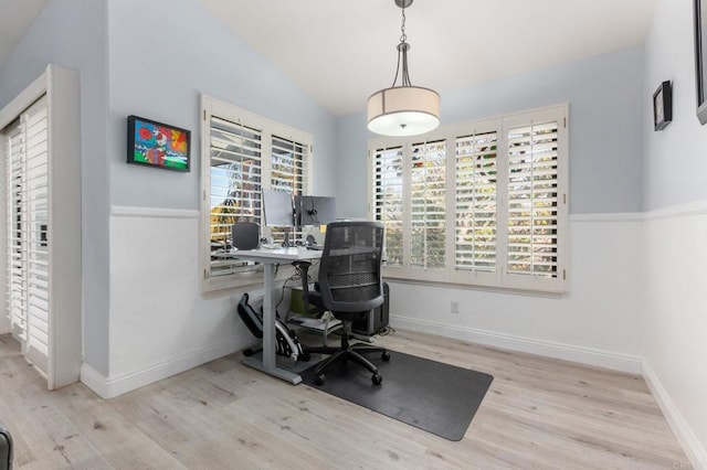 office space featuring light hardwood / wood-style floors and lofted ceiling