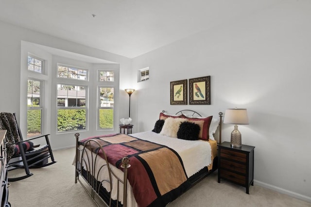 bedroom featuring light carpet