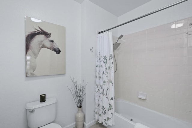 bathroom featuring shower / bathtub combination with curtain and toilet