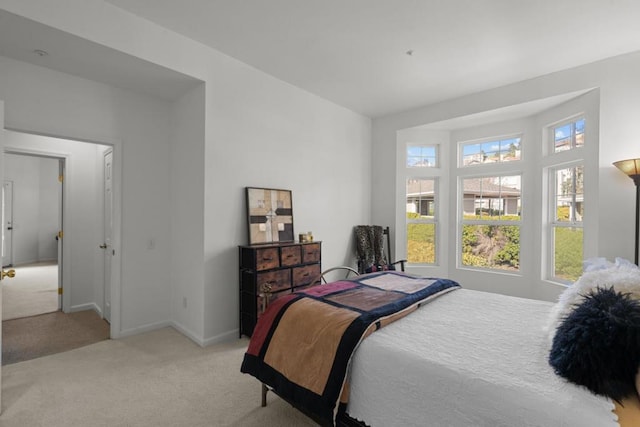 bedroom with light colored carpet