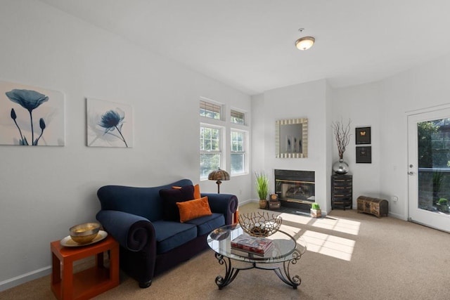 living room featuring a healthy amount of sunlight and carpet flooring