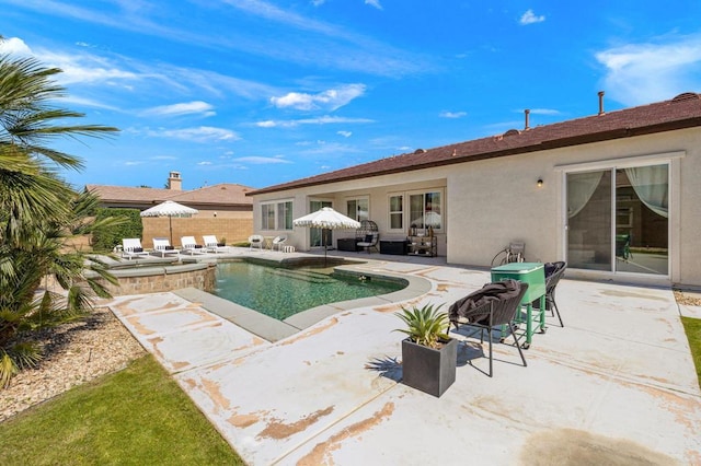 view of pool featuring a patio area