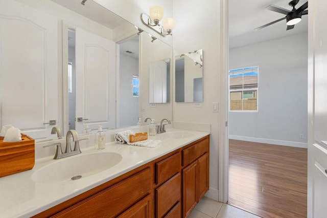 bathroom with ceiling fan, vanity, and tile patterned flooring