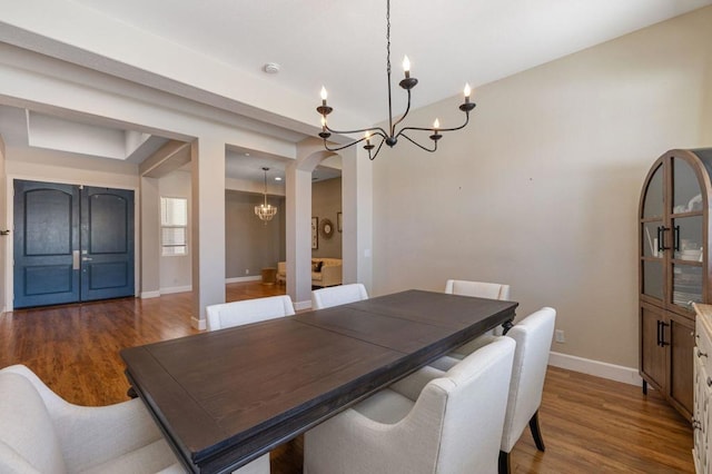 dining area with hardwood / wood-style floors