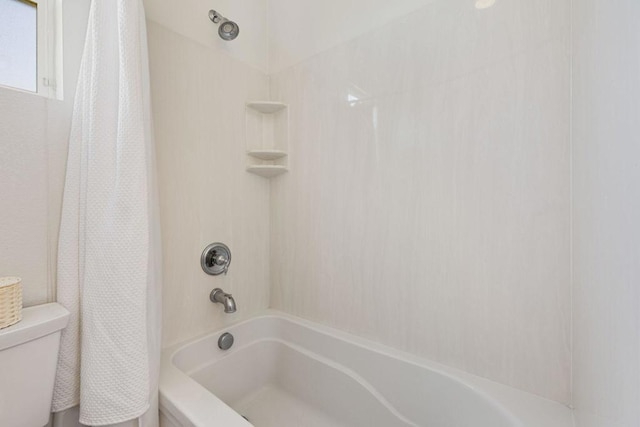 bathroom with toilet and shower / bathtub combination with curtain