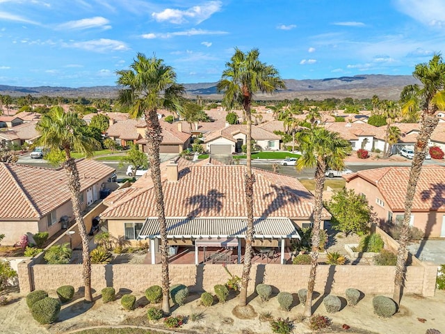 birds eye view of property with a mountain view