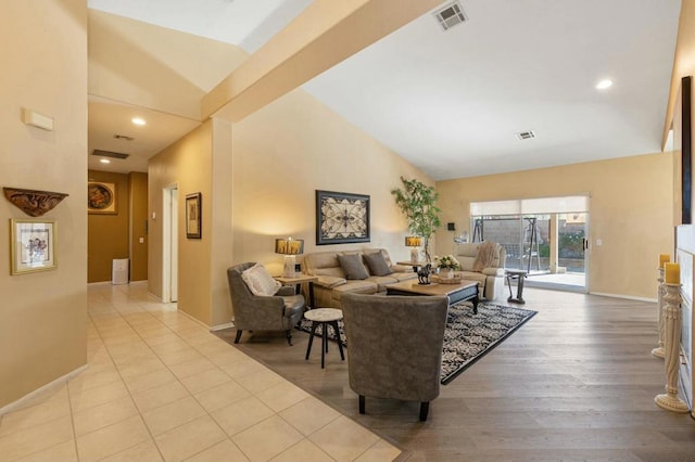 living room with lofted ceiling and light wood-type flooring