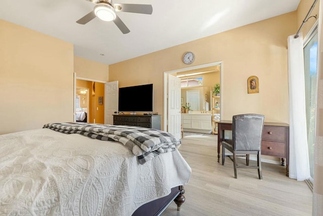 bedroom with ceiling fan, ensuite bathroom, and hardwood / wood-style floors