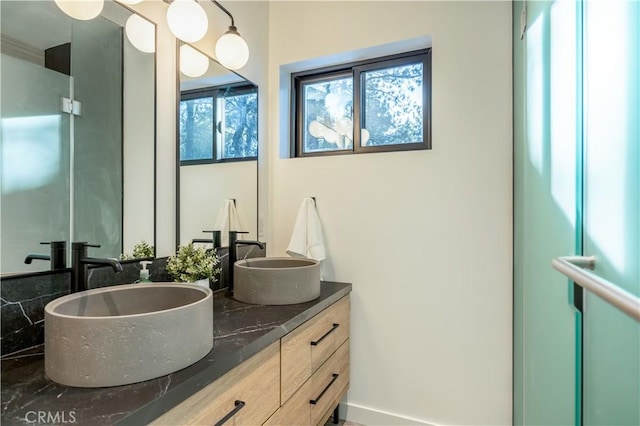 full bath featuring double vanity and a sink