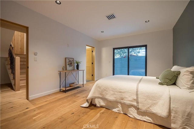 bedroom with access to exterior, visible vents, baseboards, recessed lighting, and light wood-style floors