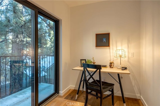 home office featuring wood finished floors and baseboards