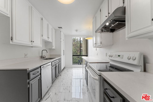 kitchen featuring electric stove, white cabinets, sink, and stainless steel dishwasher