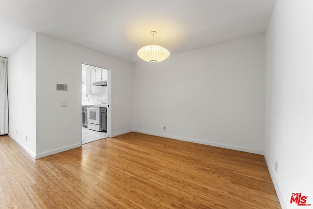 spare room with light wood-type flooring