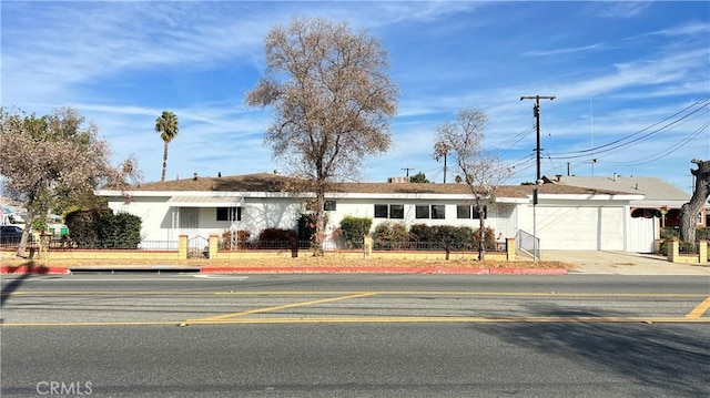 single story home with a garage