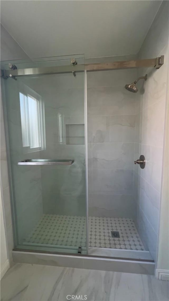 bathroom featuring an enclosed shower